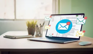 laptop showing open emails and advertising our email marketing copywriting services